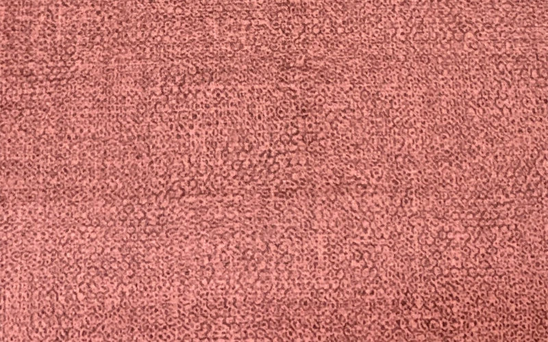 Muted red fabric material for hotel seating and accents